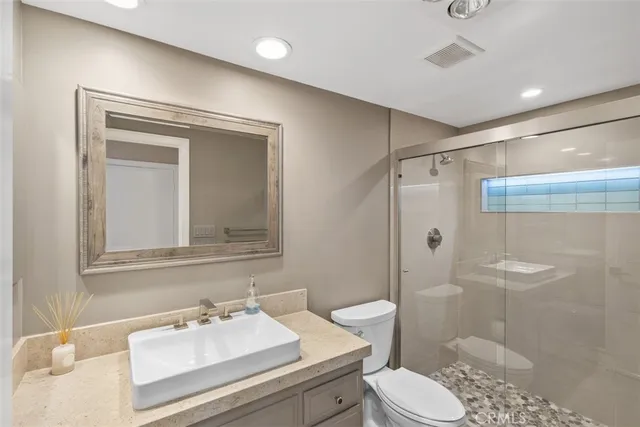 a view of a big room with windows and cabinet