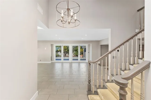 a living room with furniture a rug and white walls