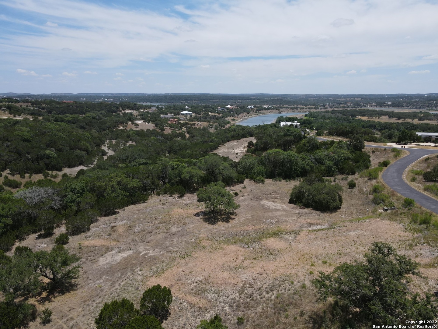 an aerial view of a houses with city view