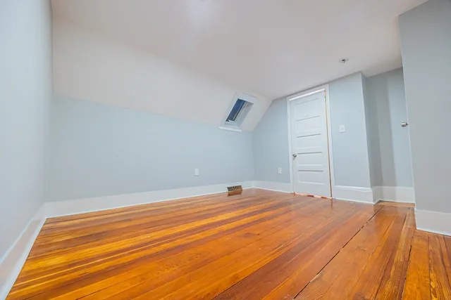 a room with a bed and cabinets