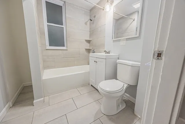a bathroom with a toilet and a bathtub
