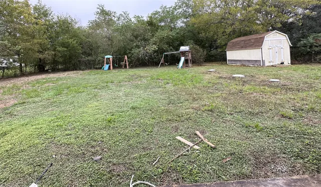 a backyard of a house with lots of green space