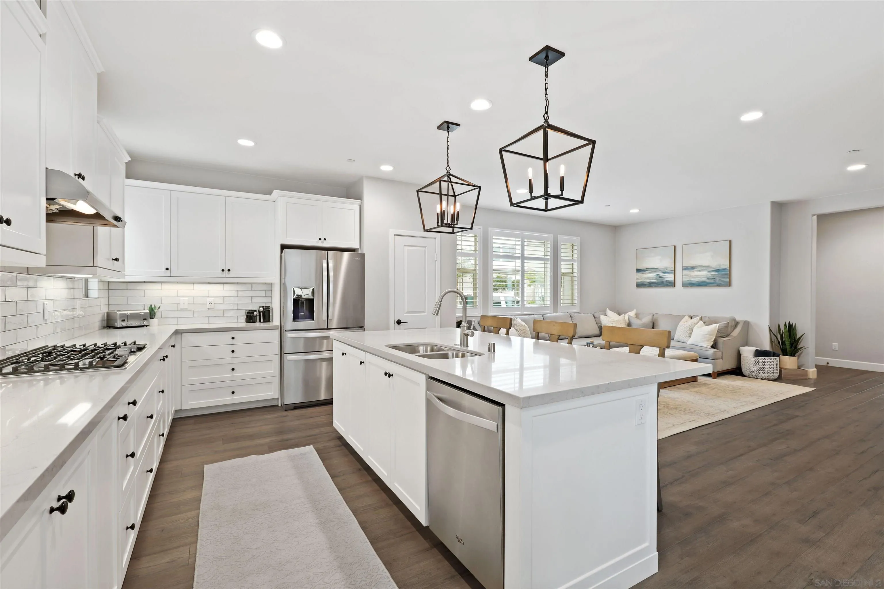 655 Gemstone Drive San Marcos, CA 92078 - Photo 12 of 48 a large white kitchen with lots of counter space sink and appliances
