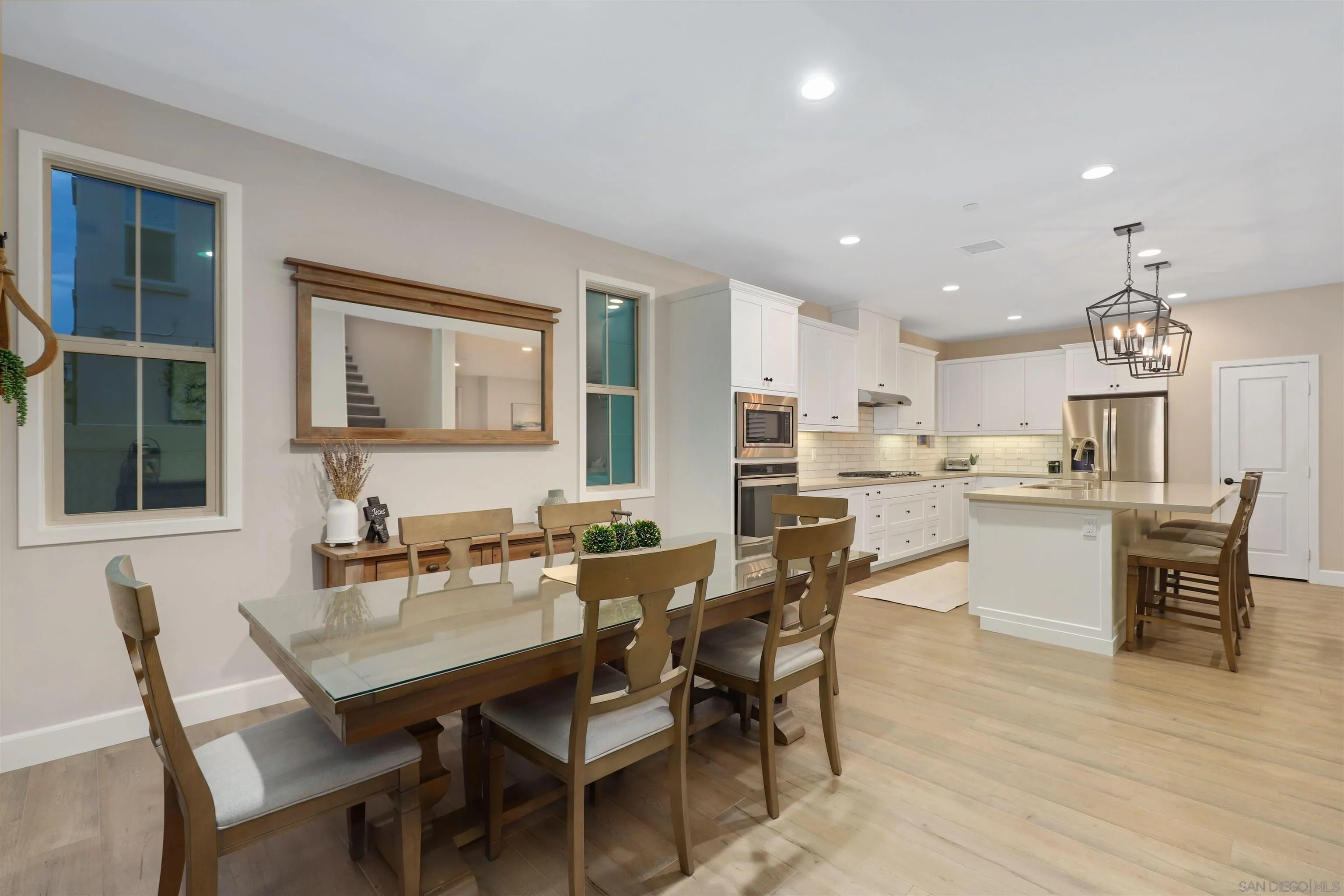 655 Gemstone Drive San Marcos, CA 92078 - Photo 15 of 48 a view of a dining room with furniture and wooden floor