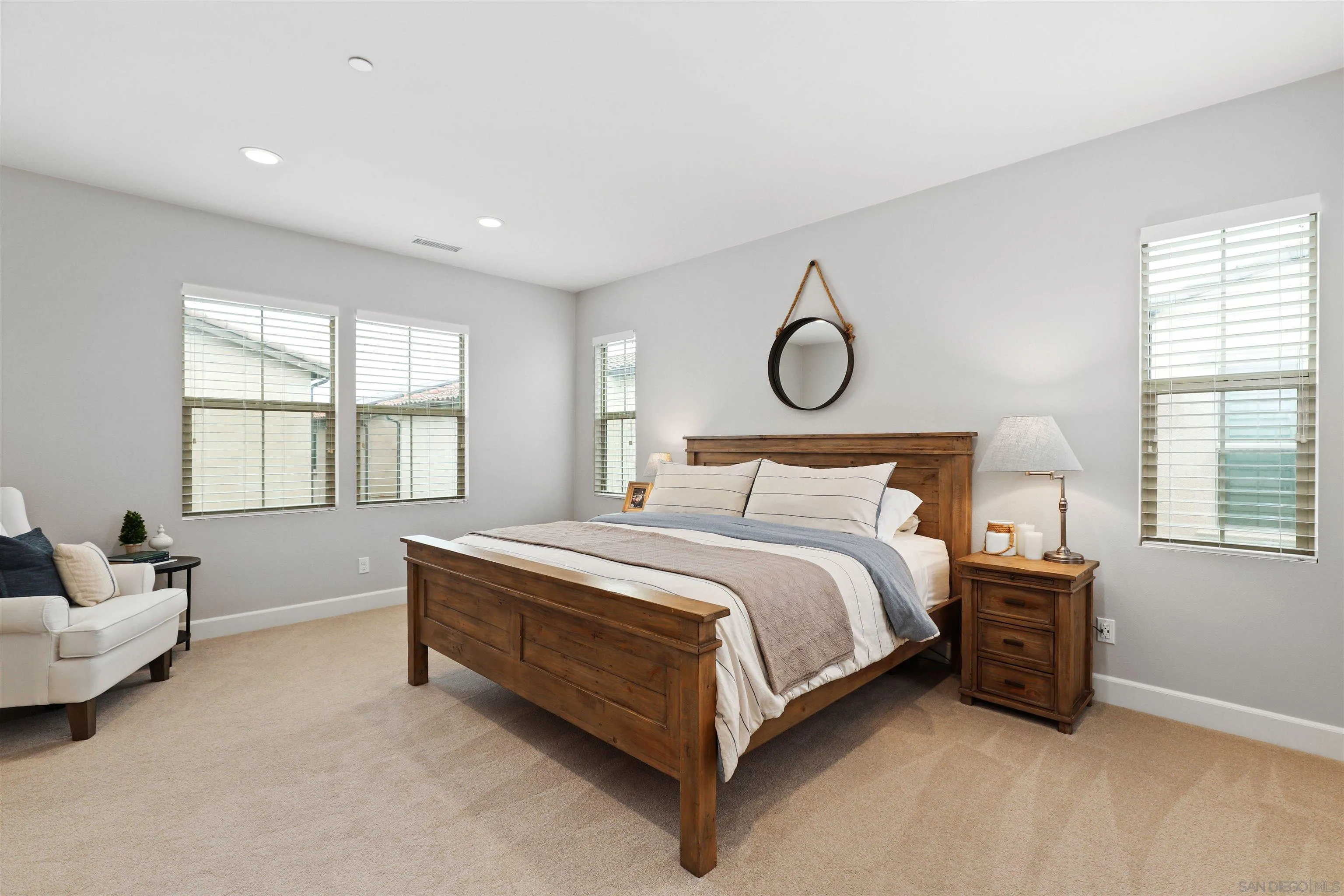655 Gemstone Drive San Marcos, CA 92078 - Photo 16 of 48 a spacious bedroom with a bed and window