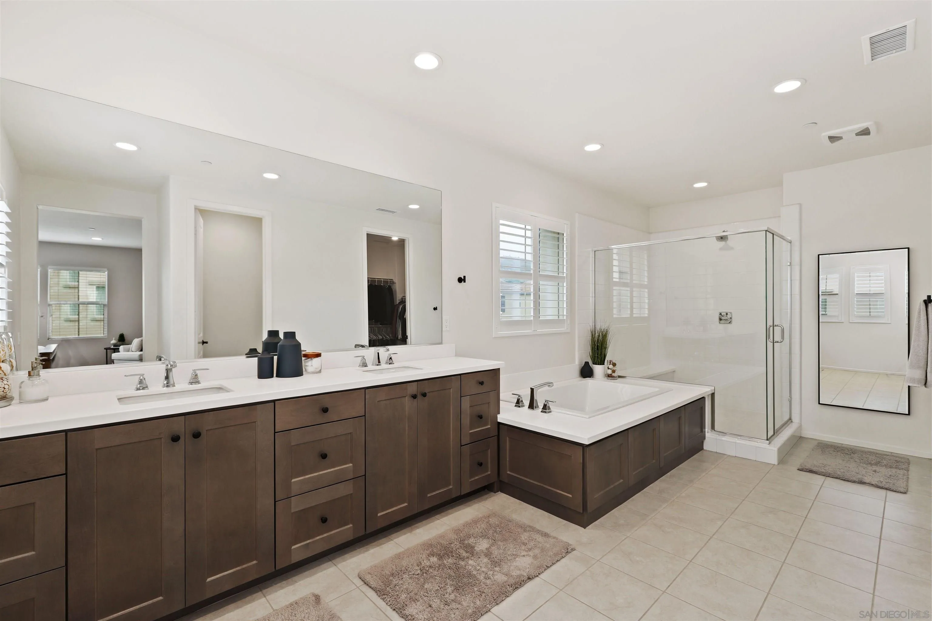 655 Gemstone Drive San Marcos, CA 92078 - Photo 17 of 48 a spacious bathroom with a double vanity sink mirror and double