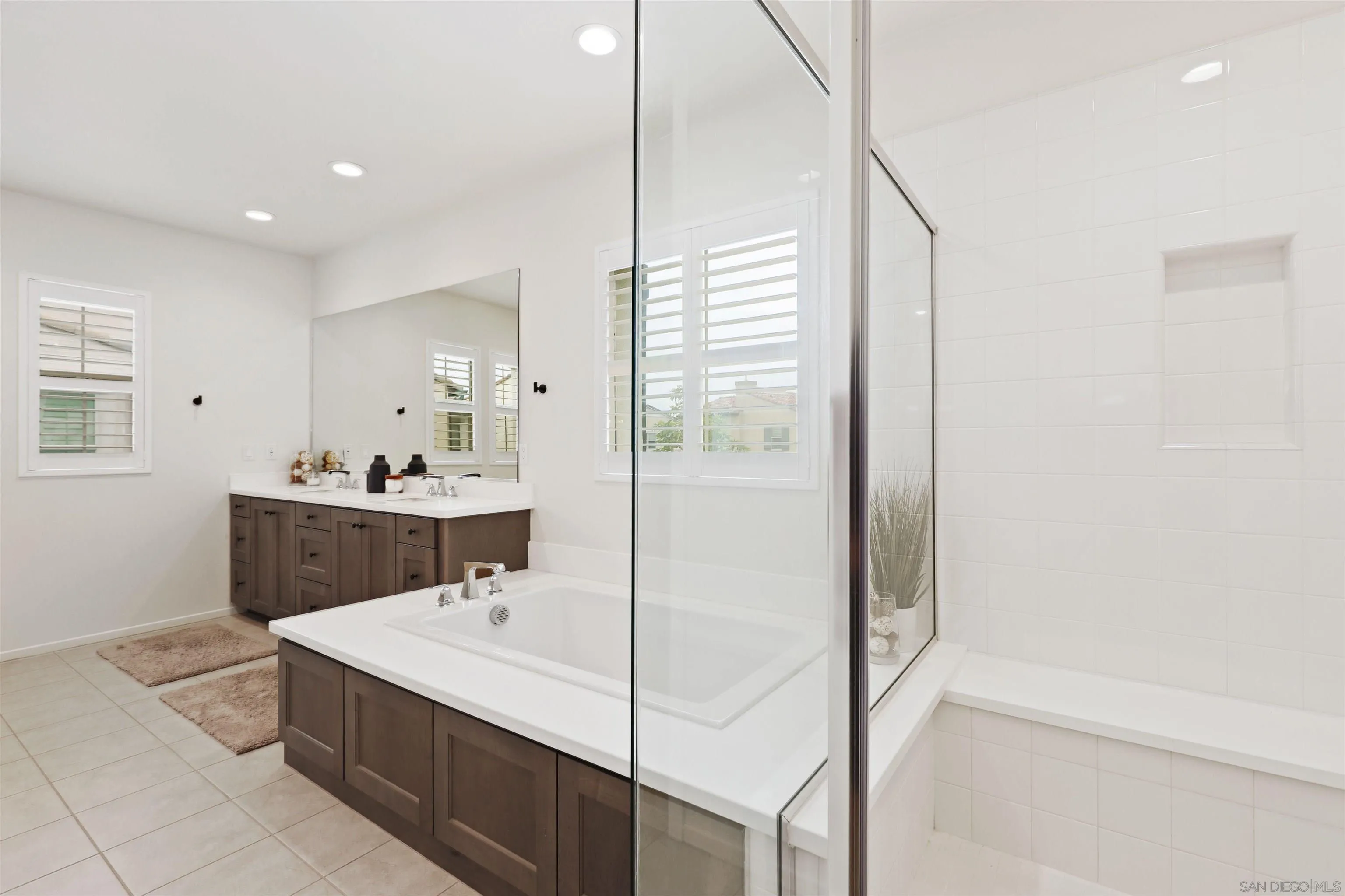 655 Gemstone Drive San Marcos, CA 92078 - Photo 19 of 48 a bathroom with a sink a toilet and shower