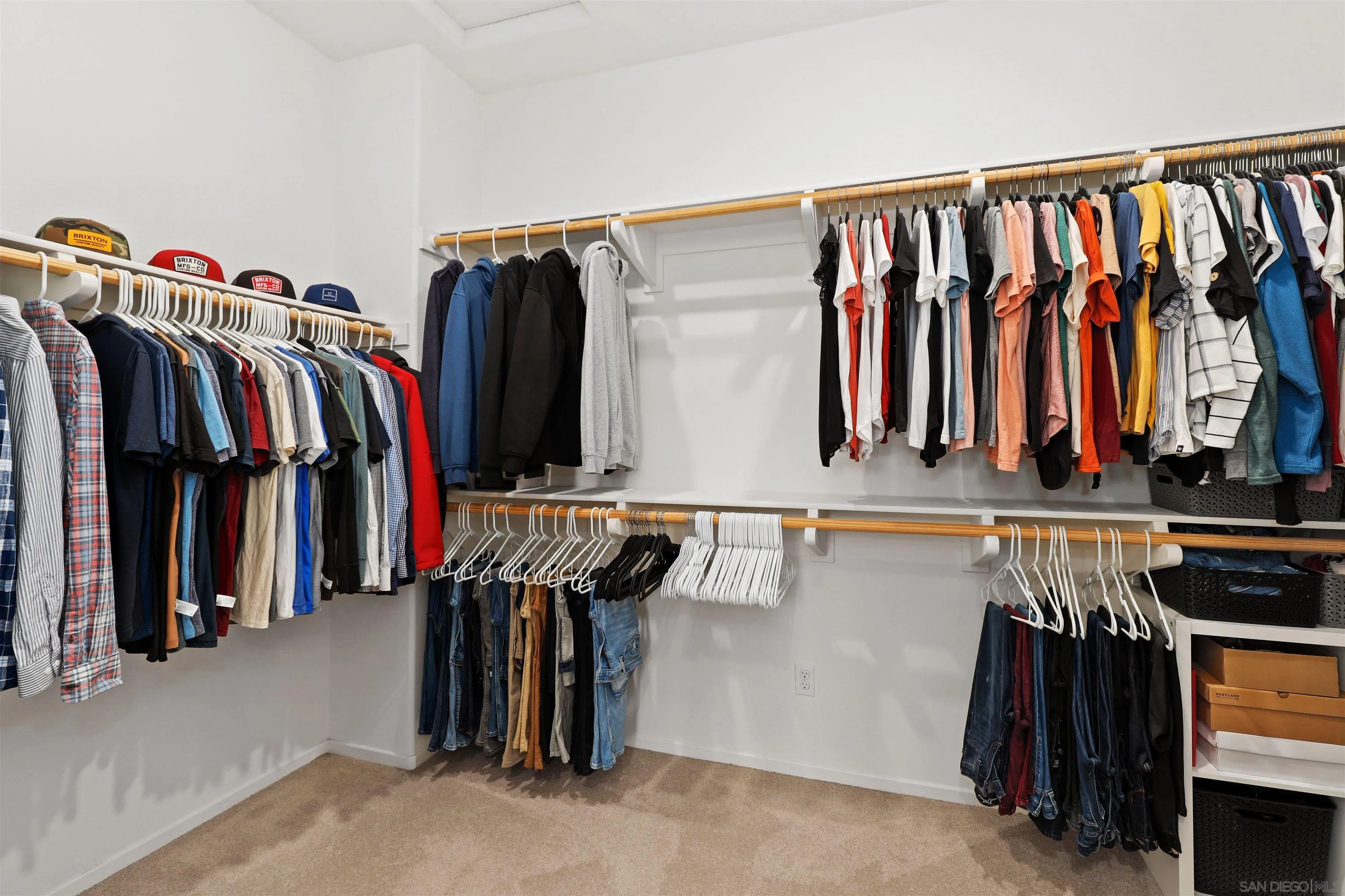 655 Gemstone Drive San Marcos, CA 92078 - Photo 20 of 48 a view of walk in closet with clothes and shoes