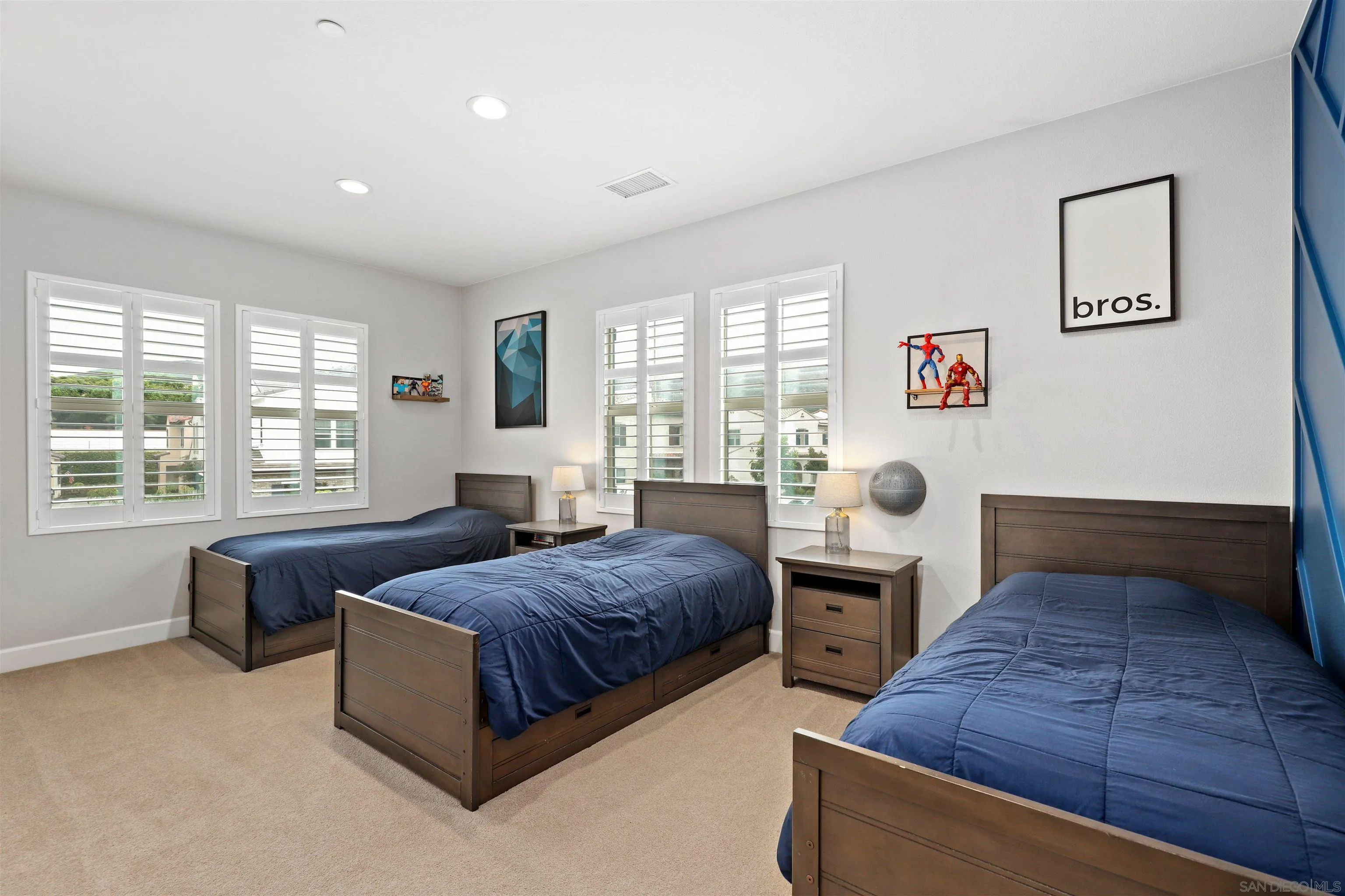 655 Gemstone Drive San Marcos, CA 92078 - Photo 21 of 48 a bedroom with a bed and a couch