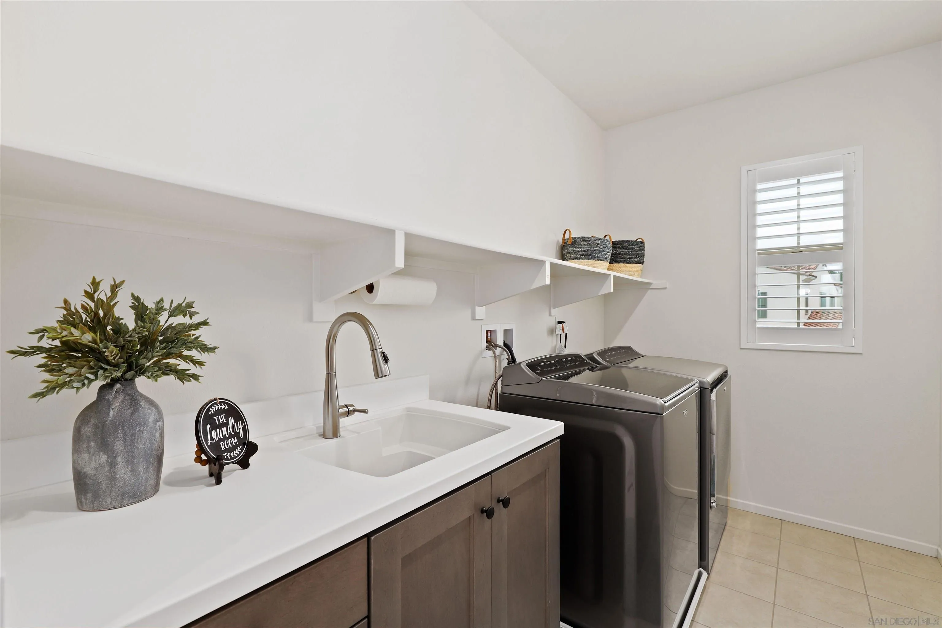 655 Gemstone Drive San Marcos, CA 92078 - Photo 22 of 48 a kitchen with a sink and a stove with wooden floor