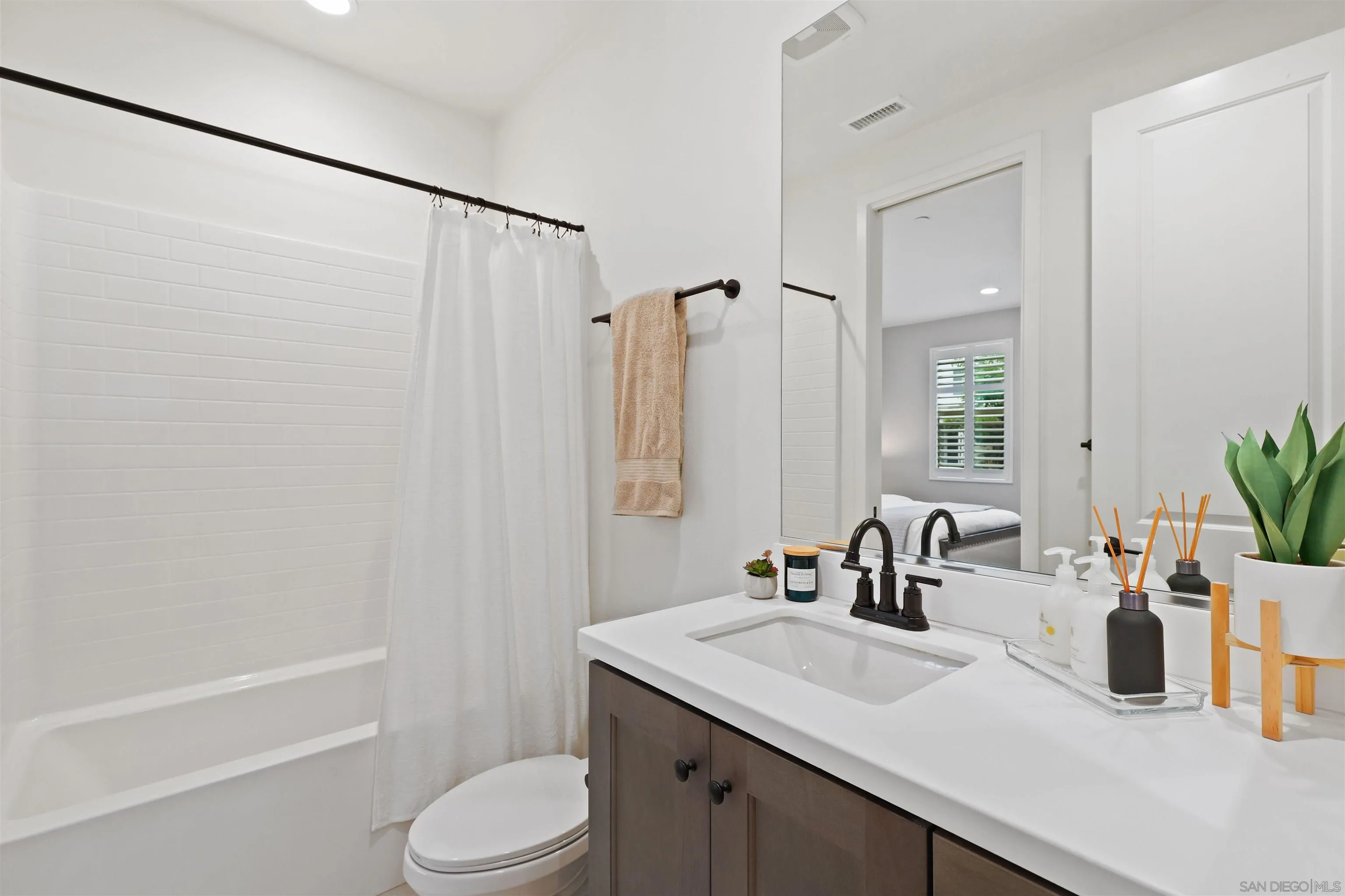 655 Gemstone Drive San Marcos, CA 92078 - Photo 28 of 48 a bathroom with a sink toilet and shower