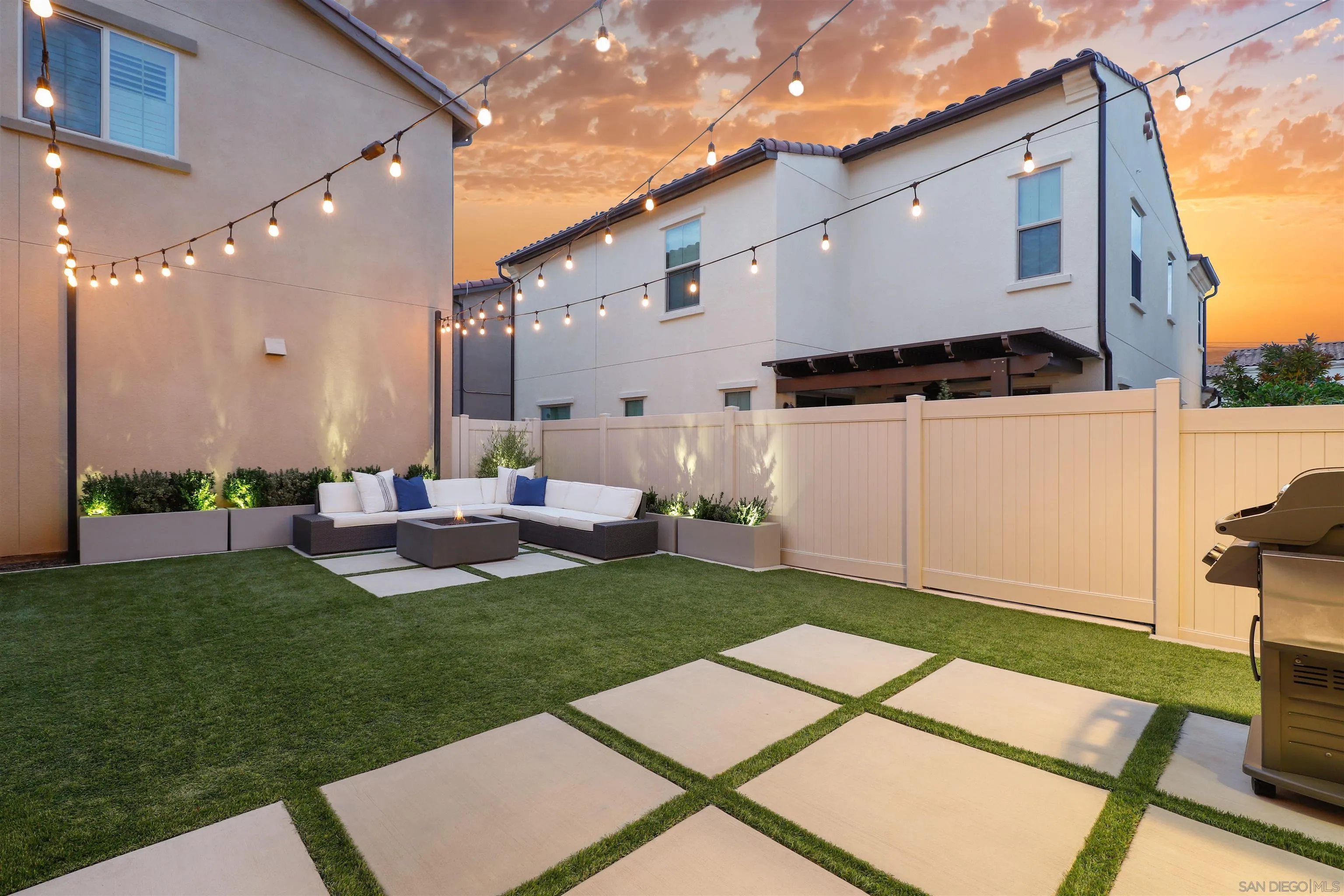 655 Gemstone Drive San Marcos, CA 92078 - Photo 3 of 48 a backyard of a house with table and chairs