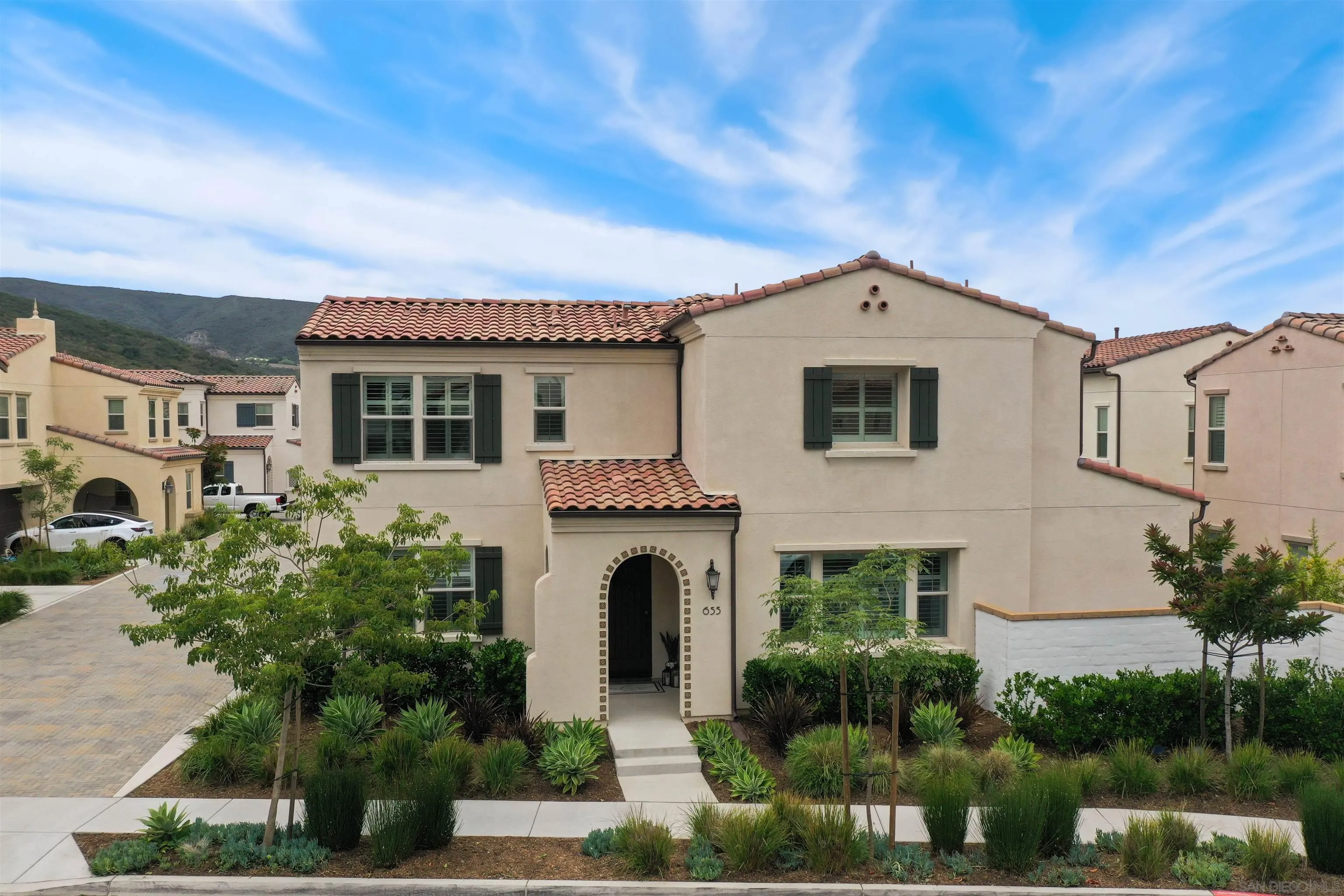 655 Gemstone Drive San Marcos, CA 92078 - Photo 40 of 48 a front view of a house with a garden