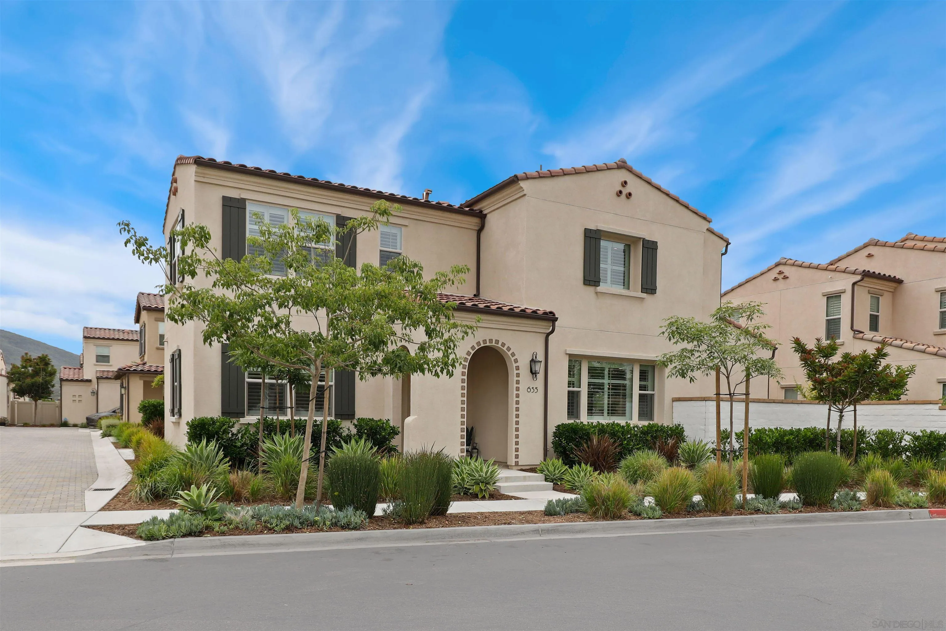 655 Gemstone Drive San Marcos, CA 92078 - Photo 41 of 48 a front view of a house with a garden