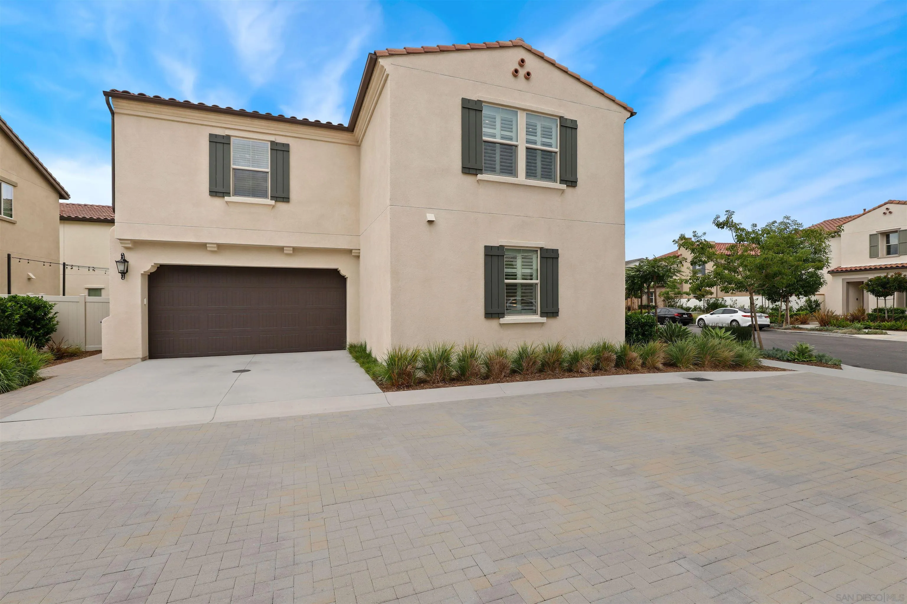 655 Gemstone Drive San Marcos, CA 92078 - Photo 42 of 48 a front view of a house with a yard and garage