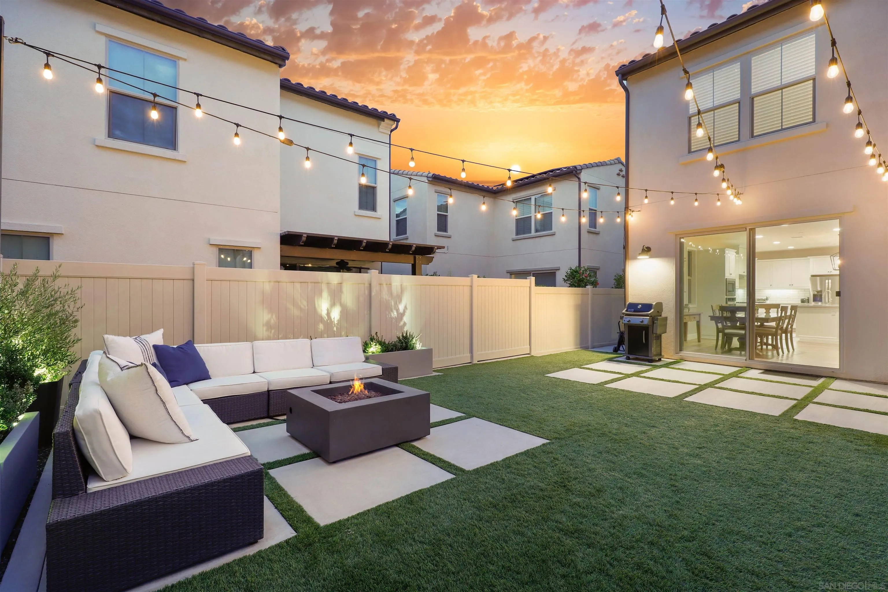 655 Gemstone Drive San Marcos, CA 92078 - Photo 6 of 48 a view of a patio with couches table and chairs and potted plants