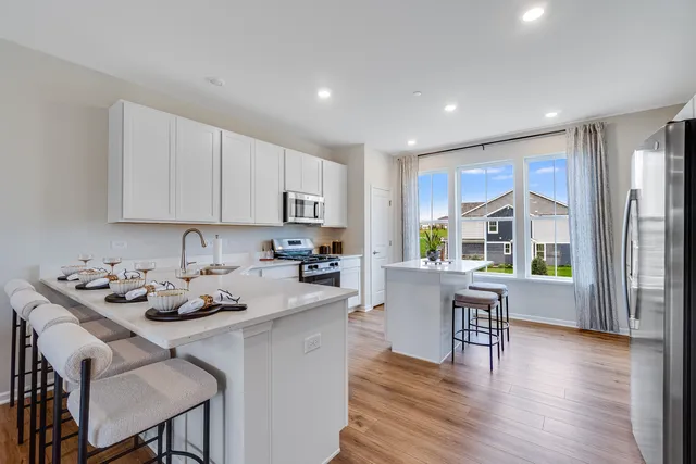 a kitchen with a table and chairs in it