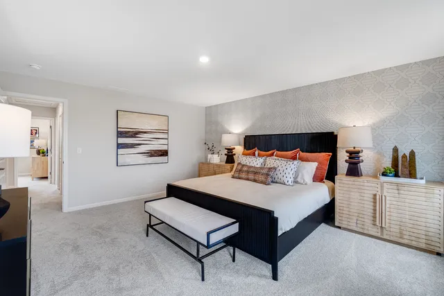 a bed room with a bed and a night stand