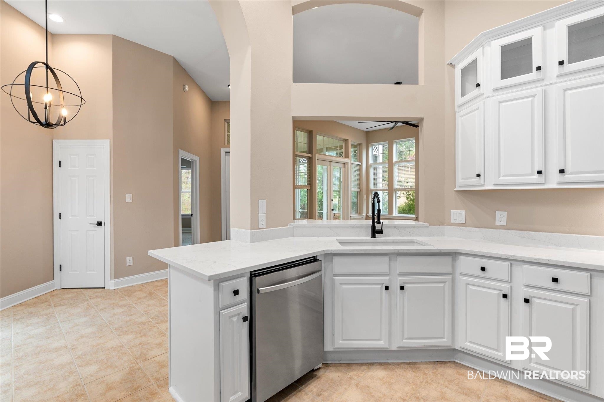 9259 Genipa Way Gulf Shores, AL 36542 - Photo 15 of 72 Kitchen featuring white cabinetry, sink, and dishwasher