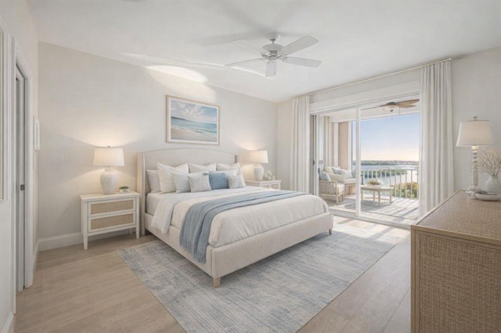 13113 Gasparilla Road, Unit 403 Placida, FL 33946 - Photo 21 of 62 a bedroom with a large bed and a chandelier