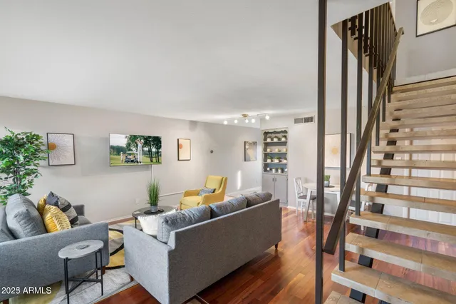 a living room with furniture and a window