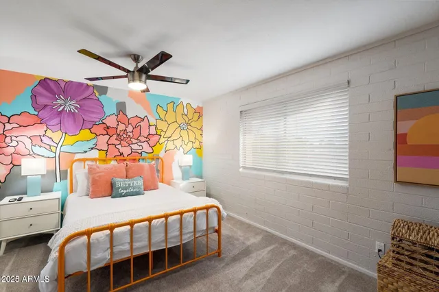 a bedroom with a bed and dresser