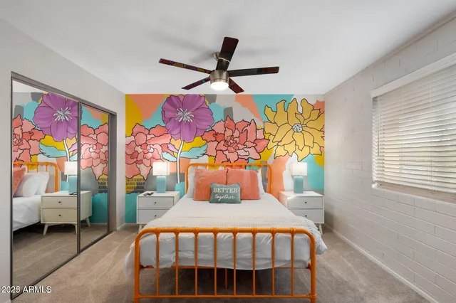 a bedroom with a bed and a window