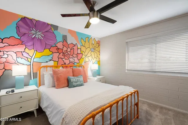 a bedroom with a bed dresser and a window