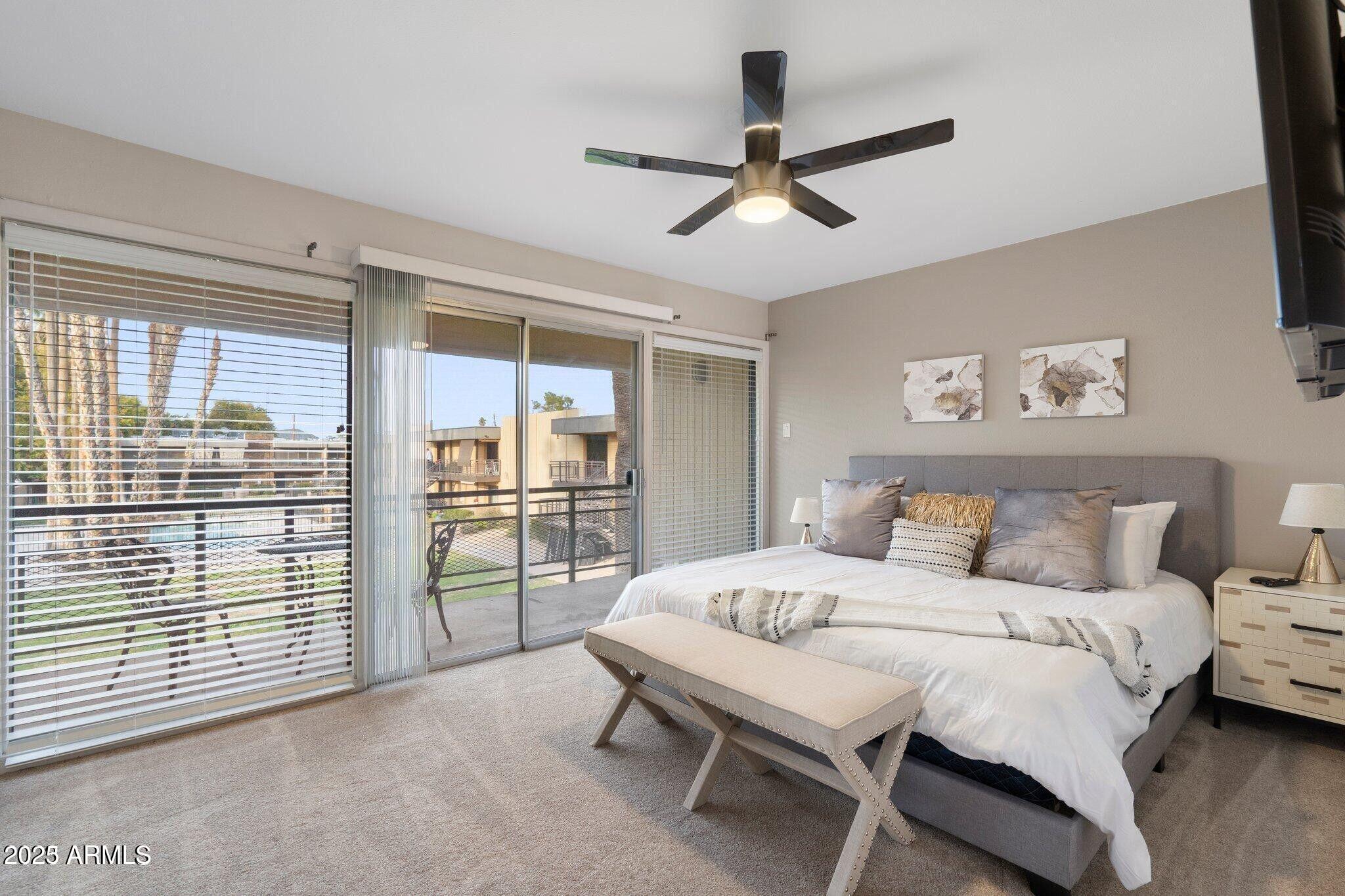 6501 North 17th Avenue, Unit 101 Phoenix, AZ 85015 - Photo 17 of 27 a bedroom with a bed and a large window