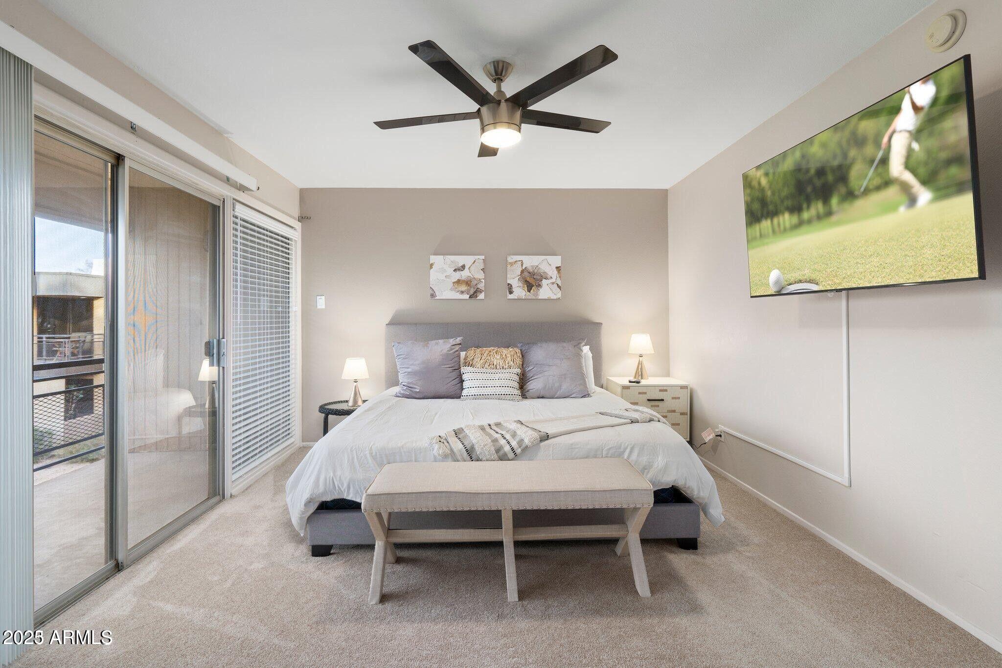 6501 North 17th Avenue, Unit 101 Phoenix, AZ 85015 - Photo 18 of 27 a bedroom with a bed and a painting on the wall