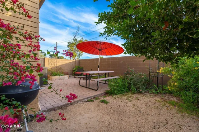 a view of a patio with a table and a chairs