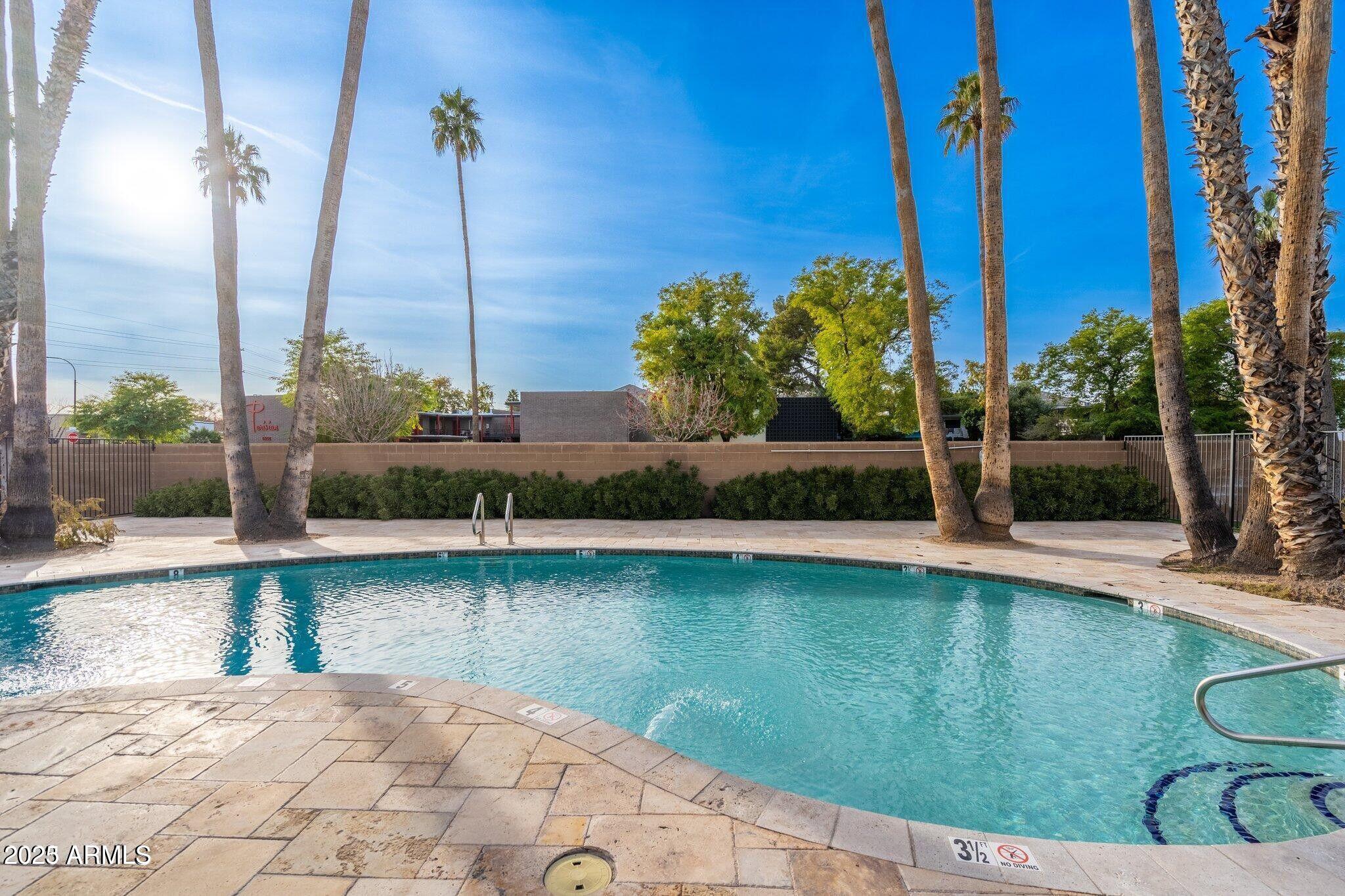 6501 North 17th Avenue, Unit 101 Phoenix, AZ 85015 - Photo 25 of 27 a view of a swimming pool with a patio