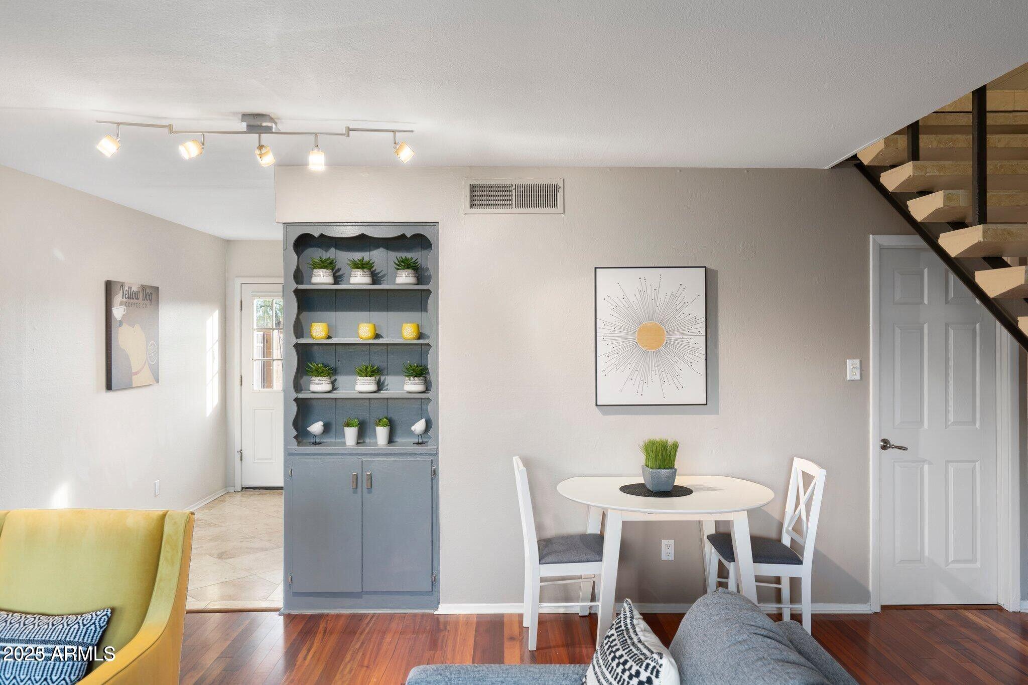 6501 North 17th Avenue, Unit 101 Phoenix, AZ 85015 - Photo 6 of 27 a living room with furniture and wooden floor