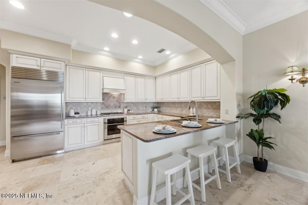 95178 Spring Tide Lane Fernandina Beach, FL 32034 - Photo 12 of 67 a kitchen with a stove sink and refrigerator