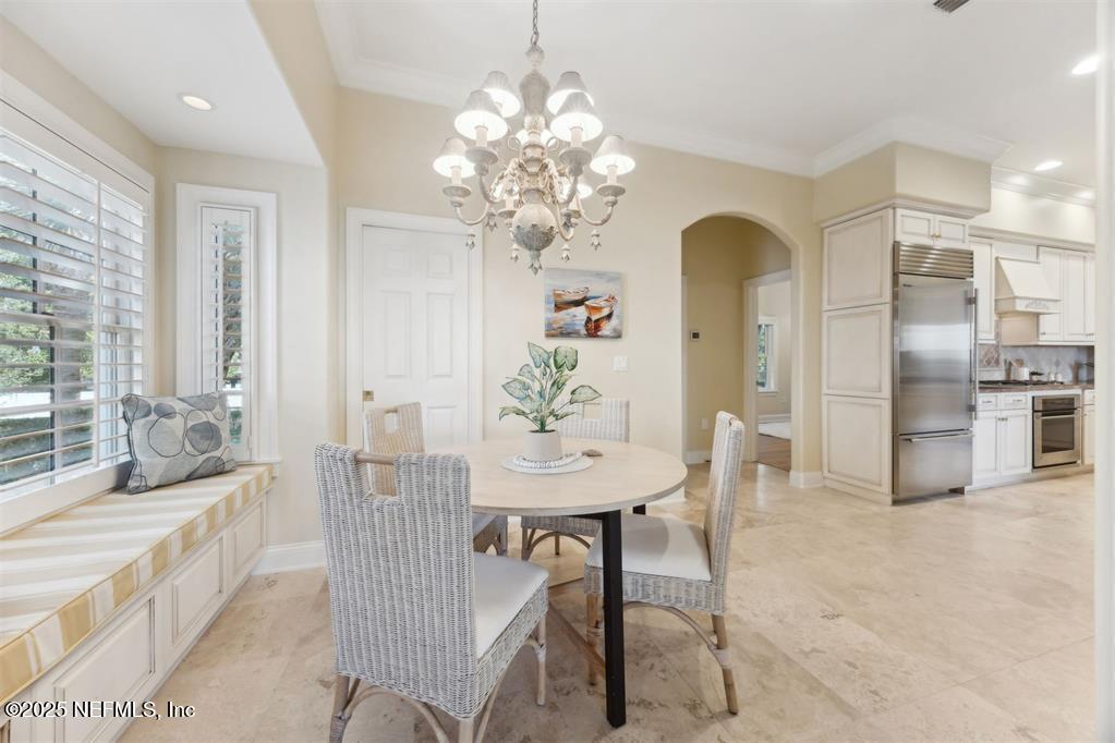 95178 Spring Tide Lane Fernandina Beach, FL 32034 - Photo 18 of 67 a view of a dining room with furniture and a chandelier