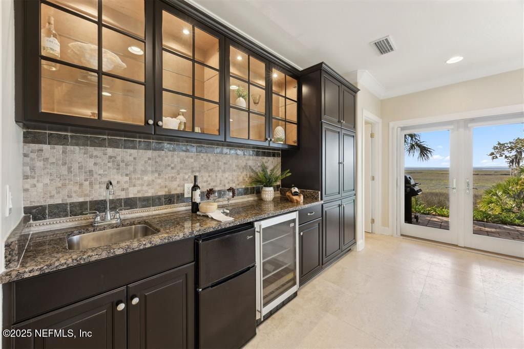 95178 Spring Tide Lane Fernandina Beach, FL 32034 - Photo 19 of 67 a kitchen with a sink stove and cabinets