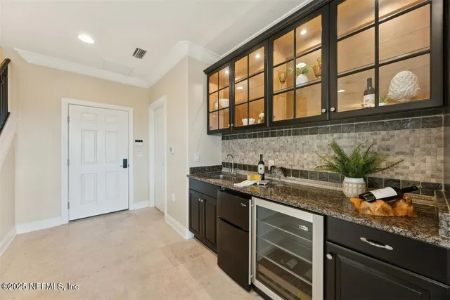 a bathroom with a granite countertop sink a mirror and a shower