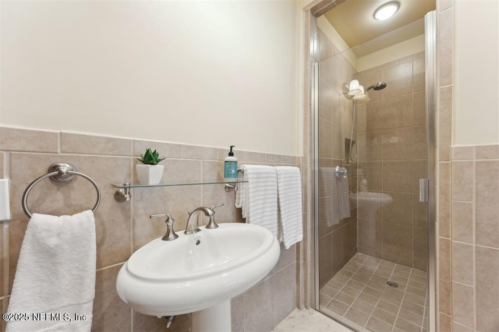 95178 Spring Tide Lane Fernandina Beach, FL 32034 - Photo 23 of 67 a bathroom with a sink and mirror