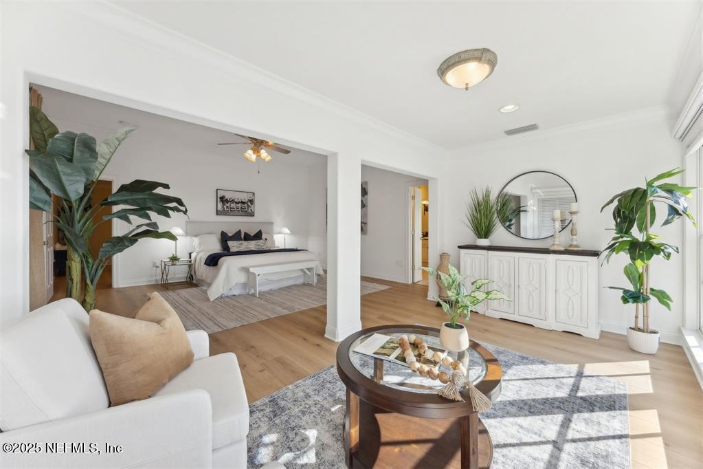 95178 Spring Tide Lane Fernandina Beach, FL 32034 - Photo 32 of 67 a living room with furniture a couch and a potted plant