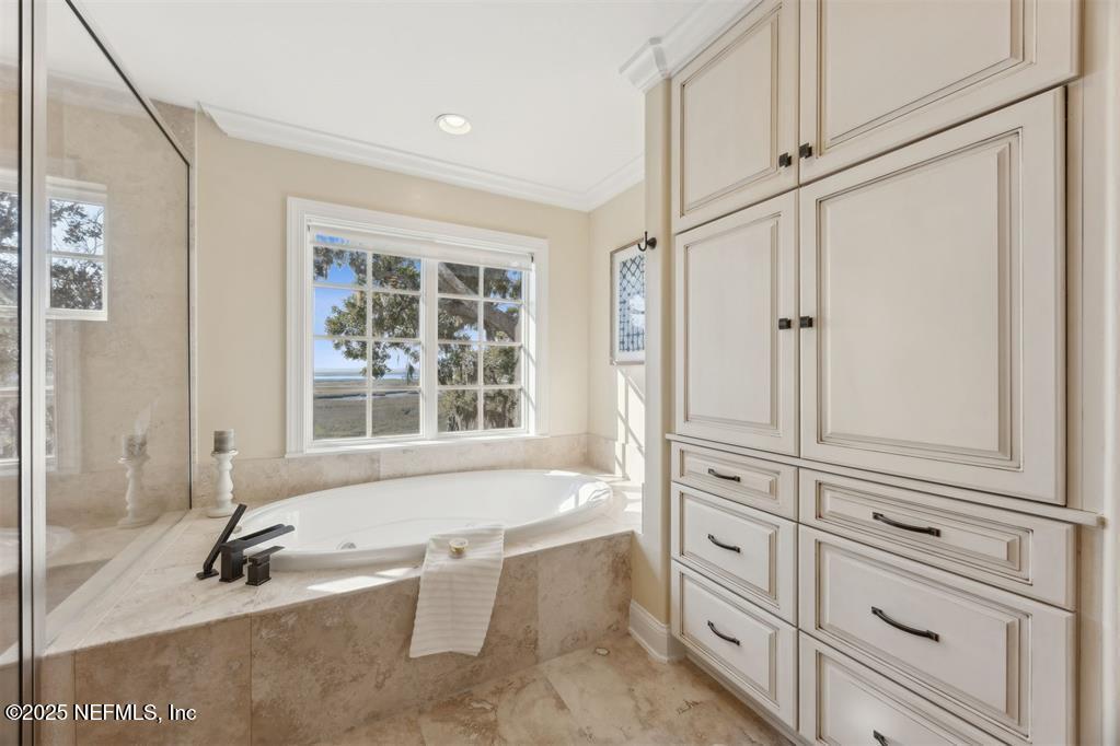 95178 Spring Tide Lane Fernandina Beach, FL 32034 - Photo 37 of 67 a bathroom with a tub a sink and a window