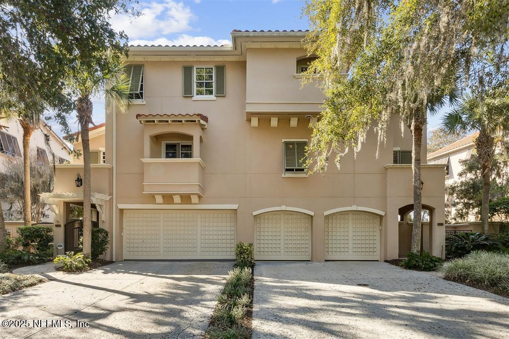 95178 Spring Tide Lane Fernandina Beach, FL 32034 - Photo 6 of 67 a front view of a house with a garage