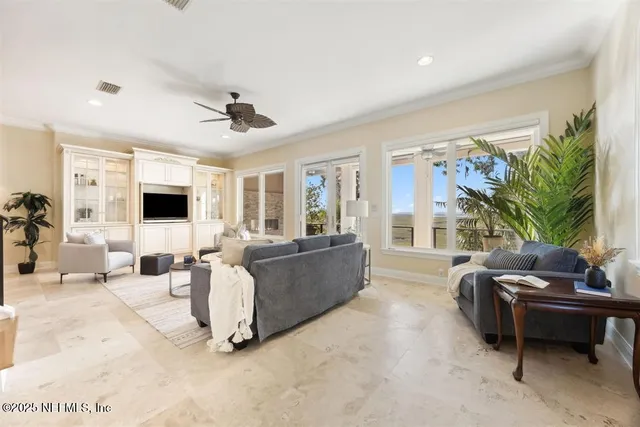 a kitchen with stainless steel appliances granite countertop a stove a refrigerator and a white cabinets