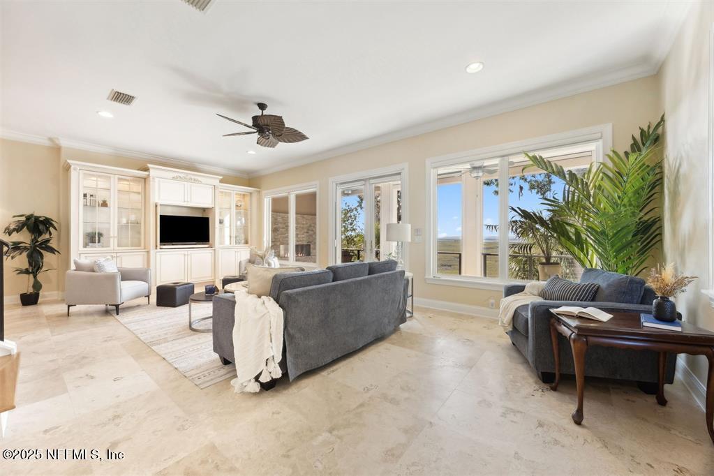 95178 Spring Tide Lane Fernandina Beach, FL 32034 - Photo 8 of 67 a living room with furniture and a flat screen tv