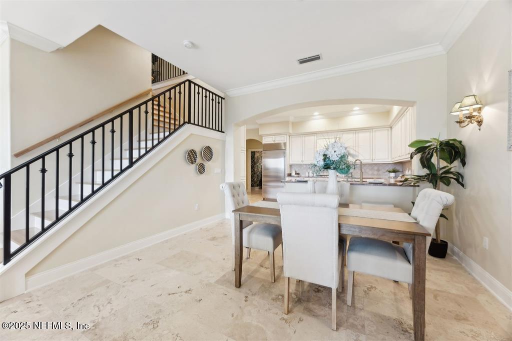 95178 Spring Tide Lane Fernandina Beach, FL 32034 - Photo 10 of 67 a dining room with furniture and a large window