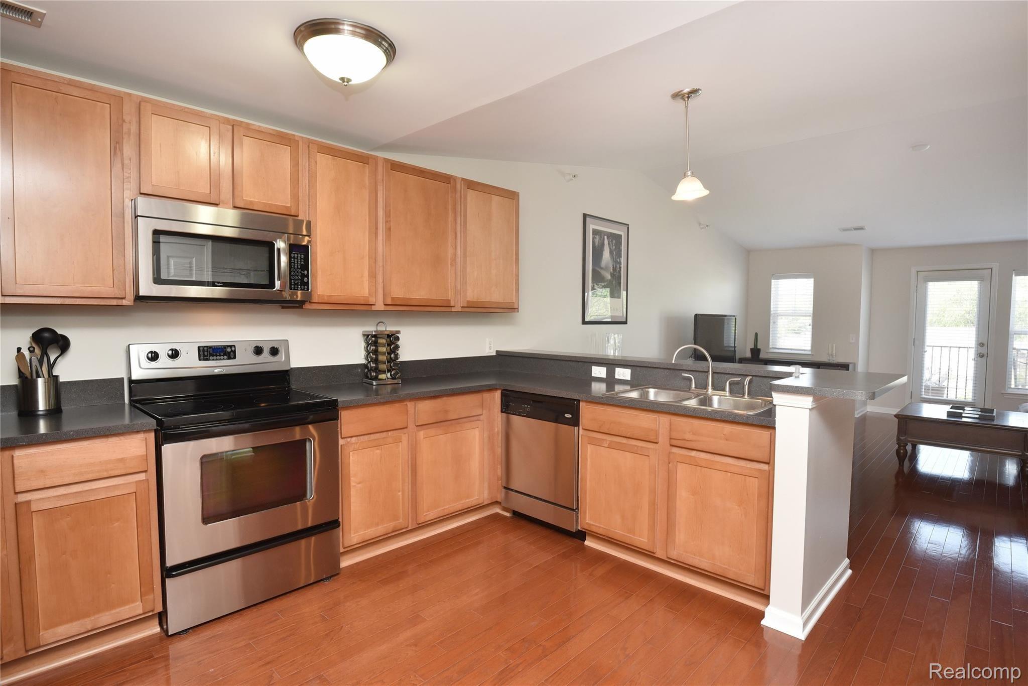 3296 Hilton Road, Unit 104 Ferndale, MI 48220 - Photo 9 of 19 LARGE KITCHEN WITH STAINLESS APPLIANCES