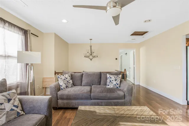 a living room with furniture and a rug