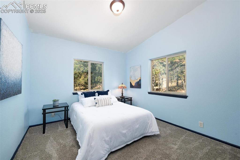 320 Hilton Road Manitou Springs, CO 80829 - Photo 15 of 44 a bedroom with a bed and a window