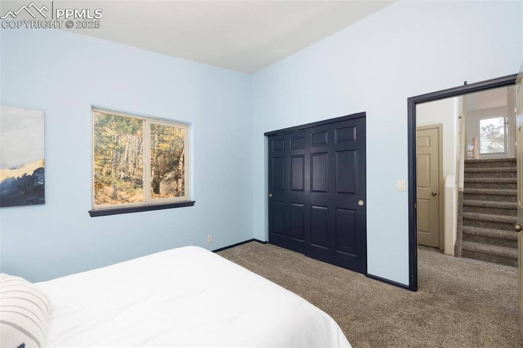 320 Hilton Road Manitou Springs, CO 80829 - Photo 16 of 44 a bedroom with a bed and a window