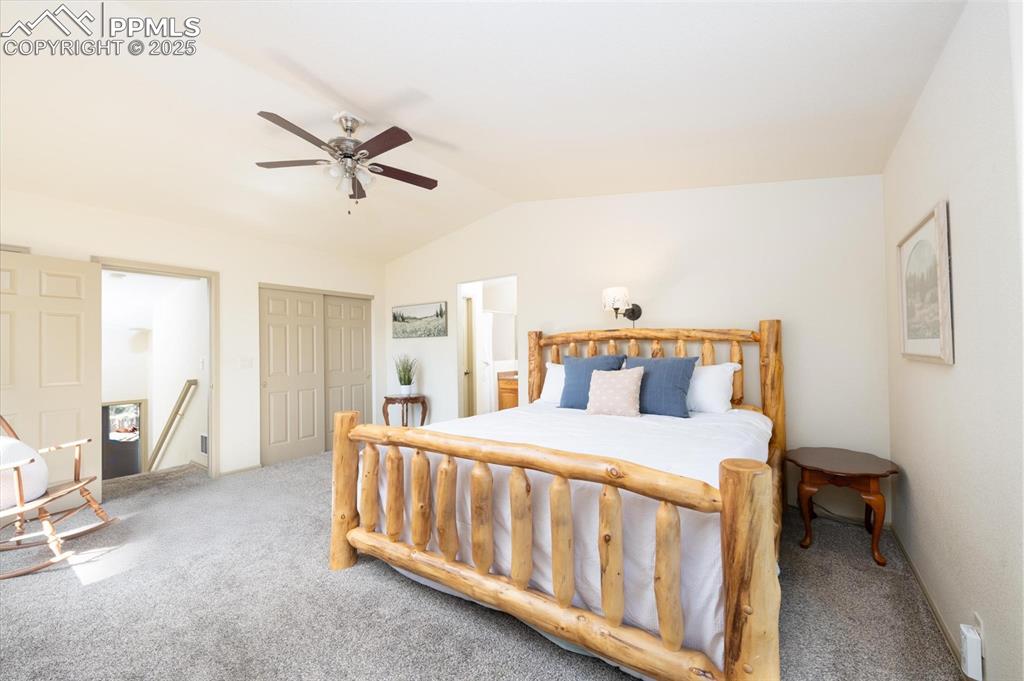 320 Hilton Road Manitou Springs, CO 80829 - Photo 22 of 44 a bedroom with a bed and large windows