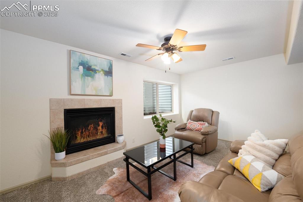 320 Hilton Road Manitou Springs, CO 80829 - Photo 28 of 44 a living room with furniture and a fireplace
